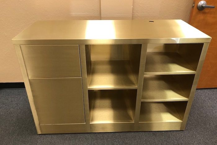 a brass cabinet with a #4 satin finish applied